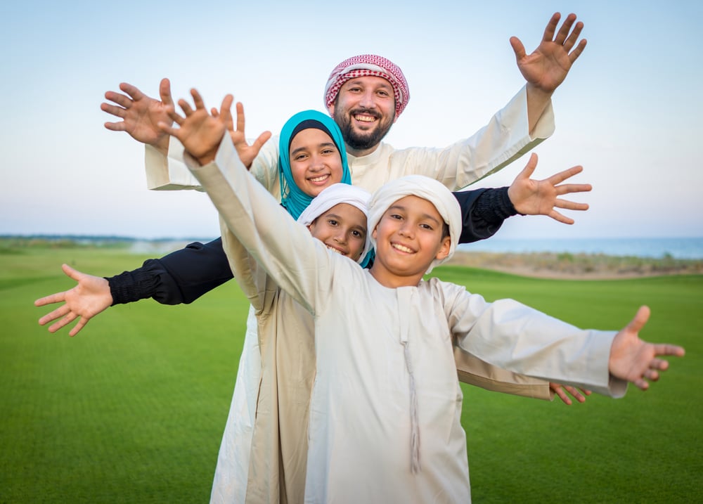 Arabic family on green meadow in nature-1