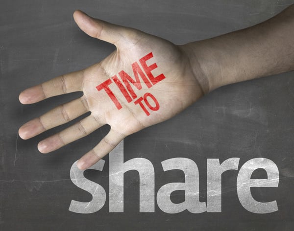 Letters on a hand "TIME TO share" and black background